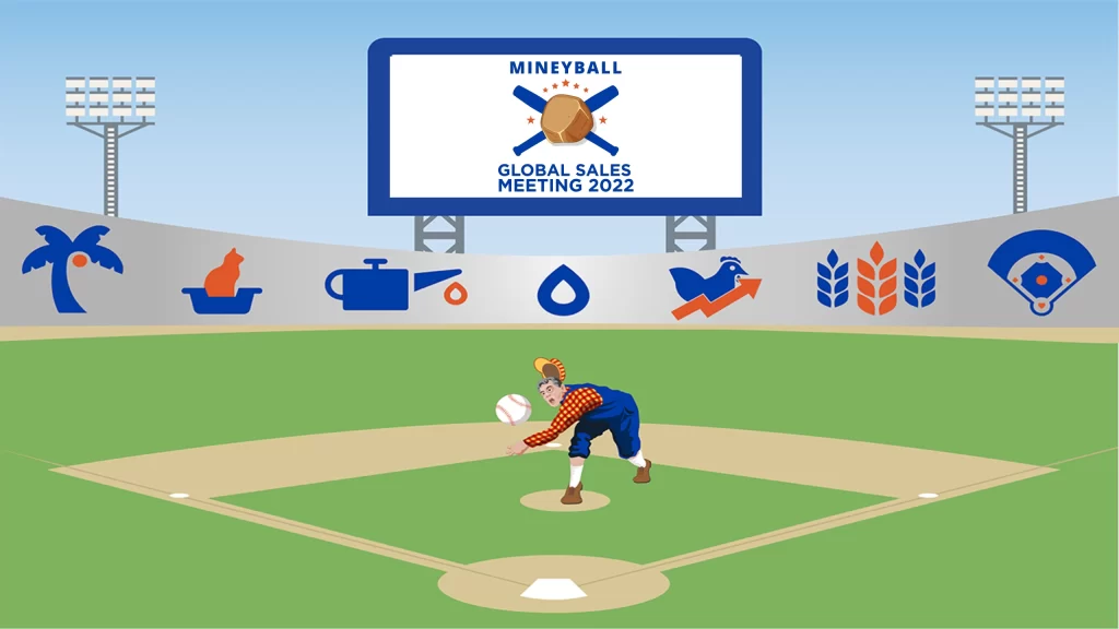 pitcher on a baseball field with stands and large screen showing the Mineyball Global Sales Meeting logo