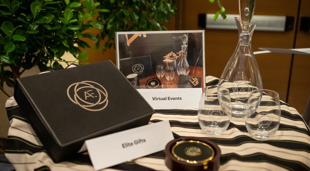 Table showcasing various branded items for an event.