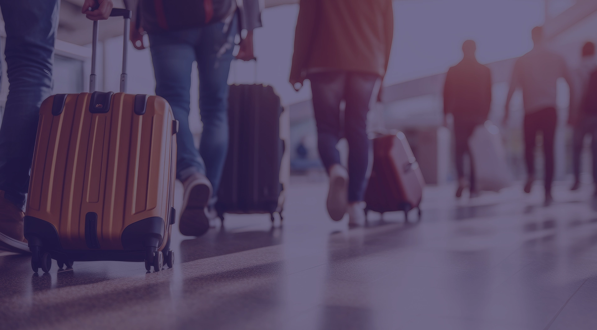 suitcases rolling on airport floor