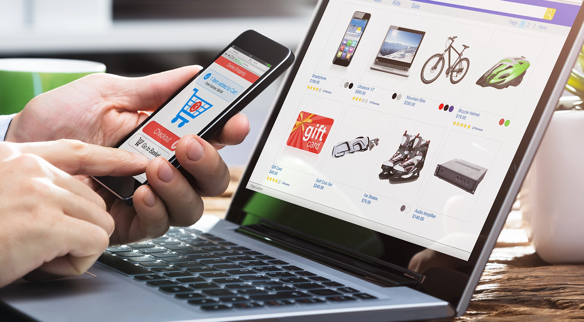 Person using a phone and laptop for gift shopping