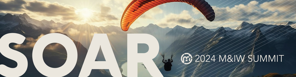 Person parasailing over mountains with a river running through them. Overlaid on the image is the word "SOAR" in large text and "2024 M&IW Summit" in smaller text.