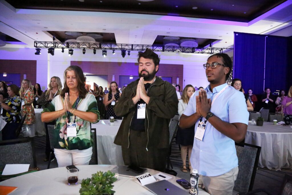 Attendees participate in a wellness break at the 2024 M&IW Summit