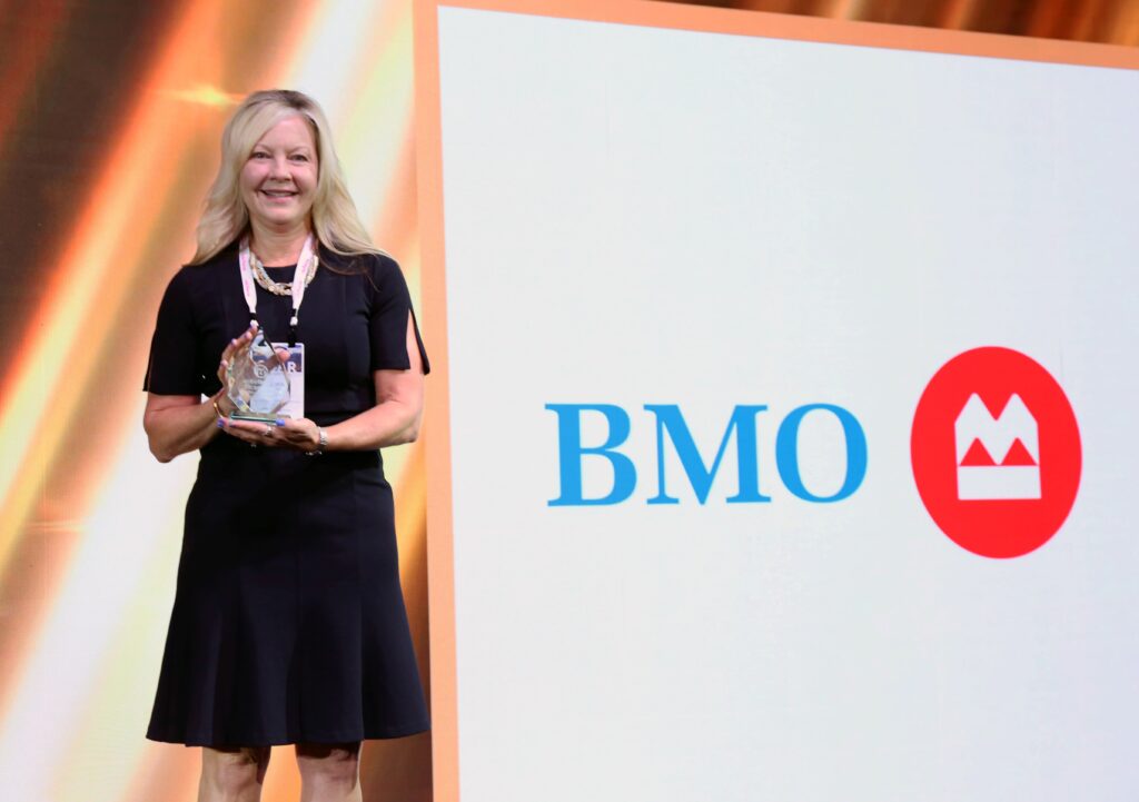 Carol Attak accepting the Moxie Award for BMO