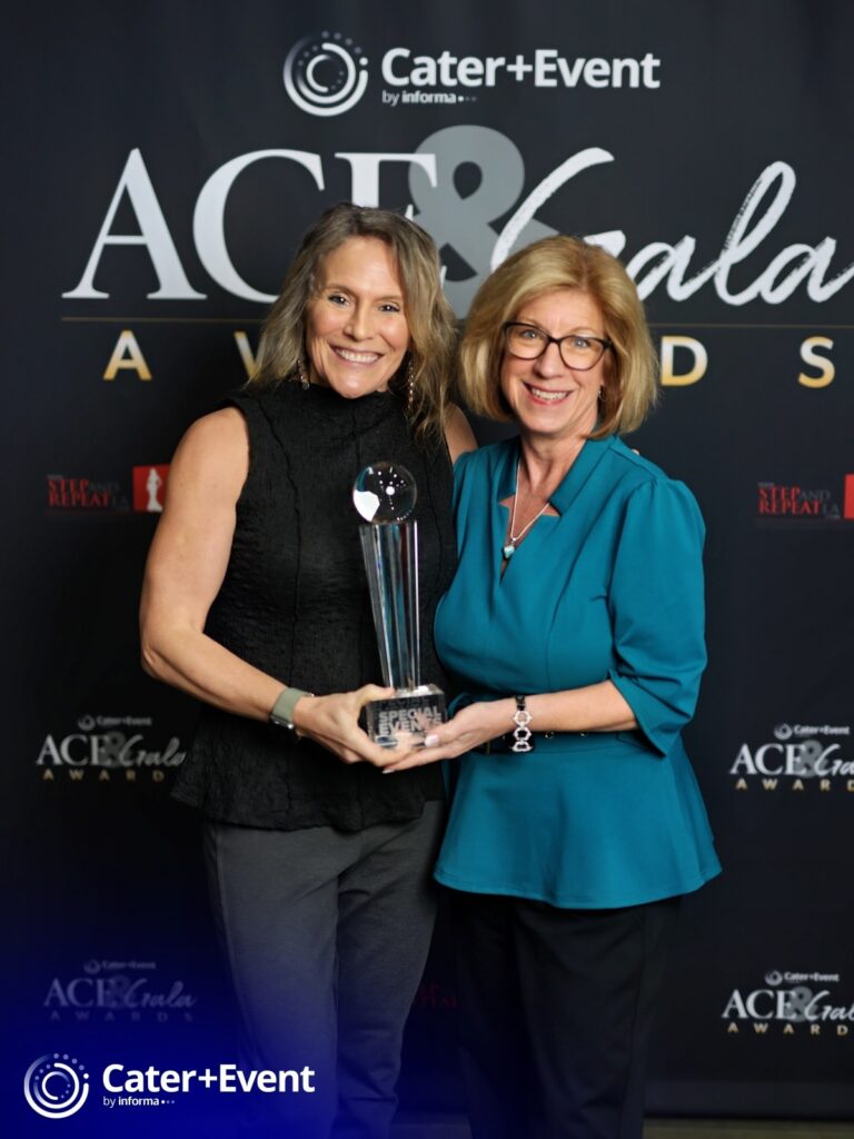 M&IW's Kelly Peiffer, left, and Tracy Norum pose with M&IW's 2026 Gala Award trophy