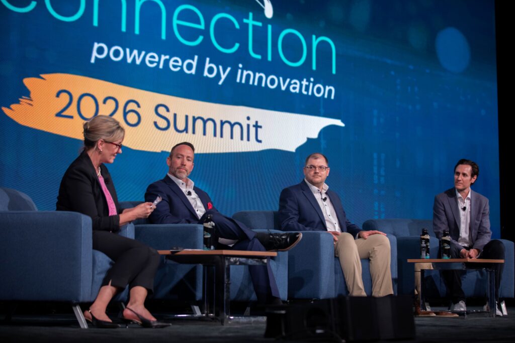Panelists onstage at the 2026 M&IW Summit