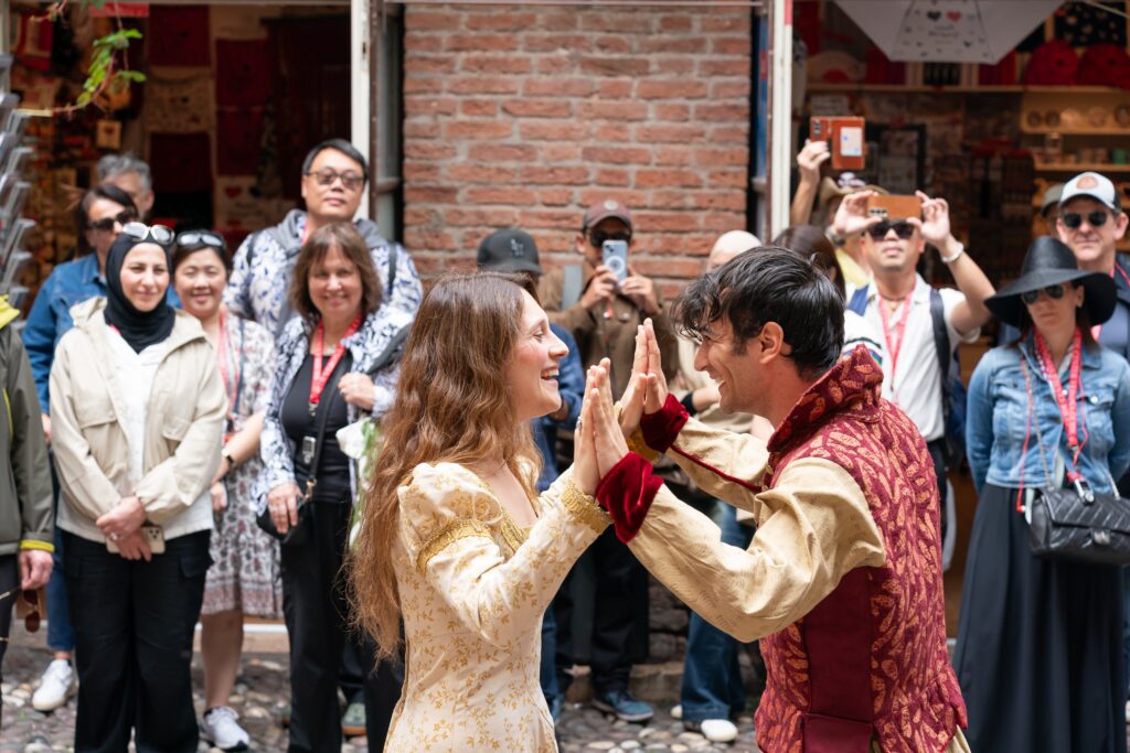 Attendees watch actors perform Romeo & Juliet in Verona